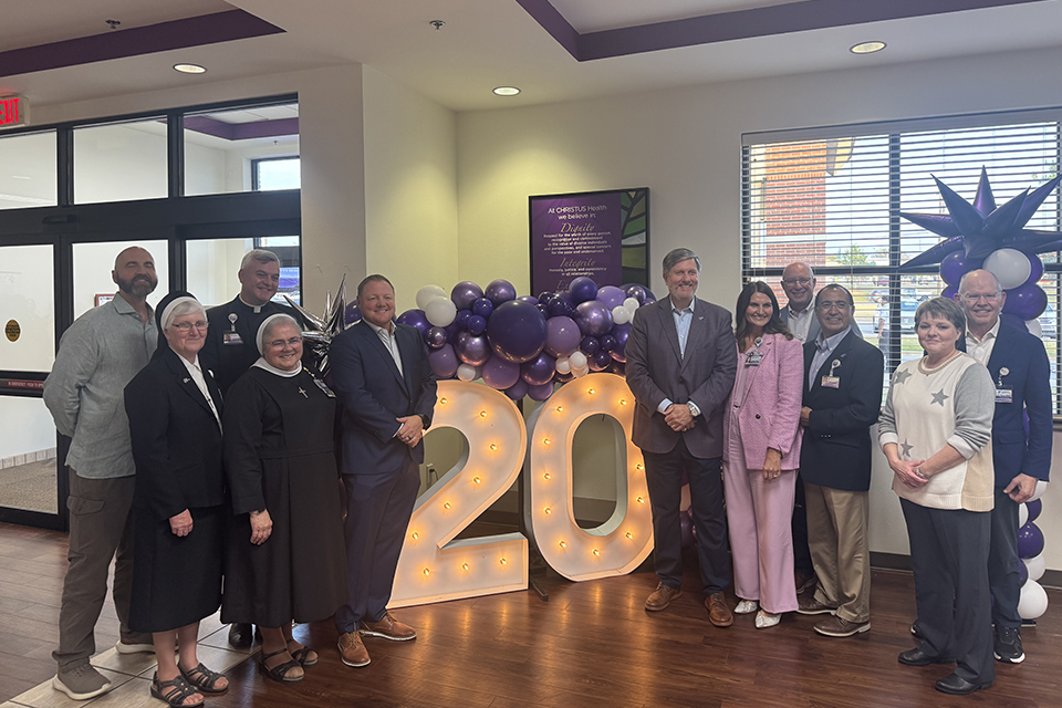 CHRISTUS Leadership with 20th Sign in Lindale
